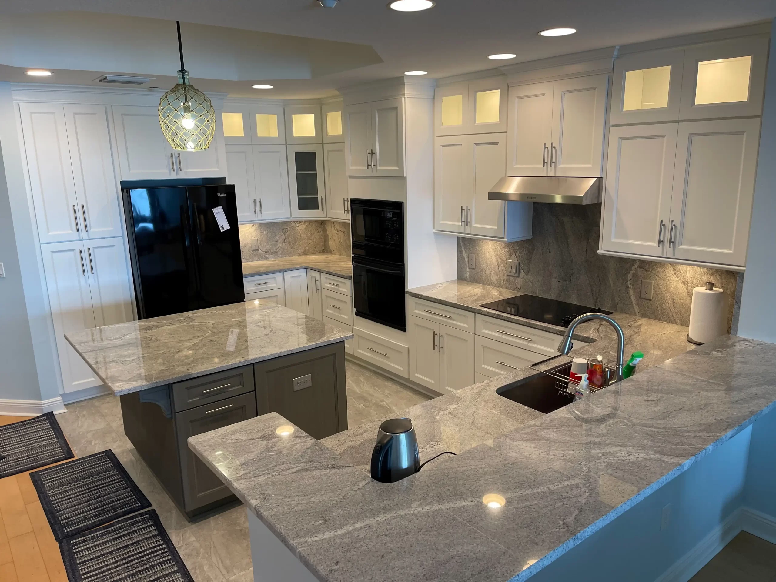 Kitchen cabinet showroom in Clearwater, FL, featuring white shaker displays.