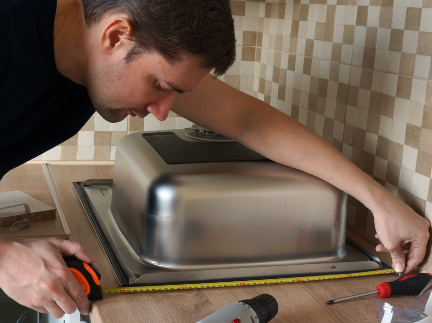 Durable solid wood cabinet box construction with dovetail drawers for Dunedin kitchens.